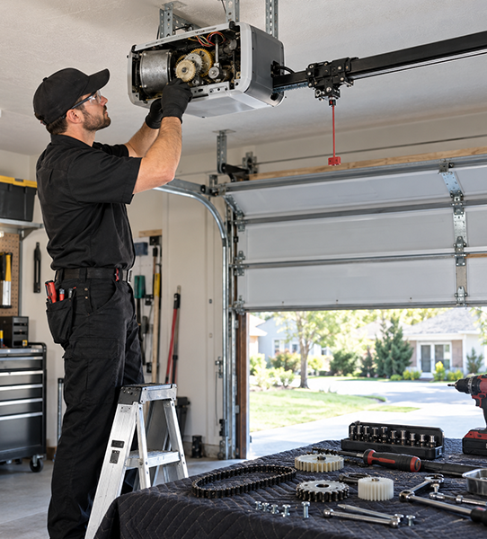 Off track garage door realignment and roller repair in Conroe TX